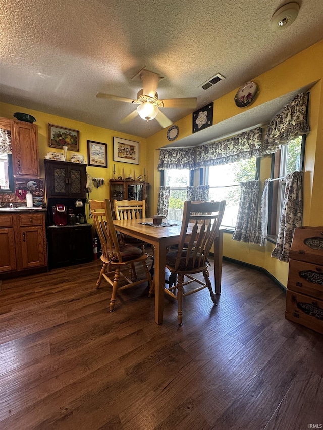 619 Briarfield Dr, Fort Wayne, IN 46825 - dining space with a textured ceiling, dark wood finished floors, and ceiling fan