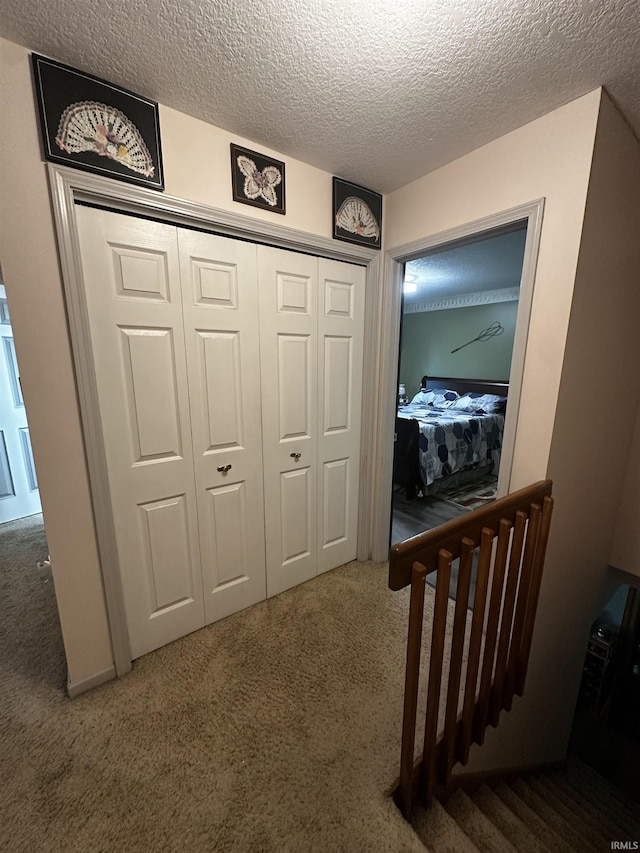 619 Briarfield Dr, Fort Wayne, IN 46825 - hallway with carpet floors and a textured ceiling