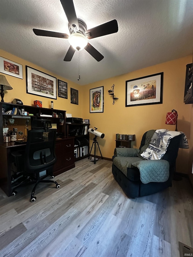 619 Briarfield Dr, Fort Wayne, IN 46825 - office area featuring wood finished floors, ceiling fan, and a textured ceiling