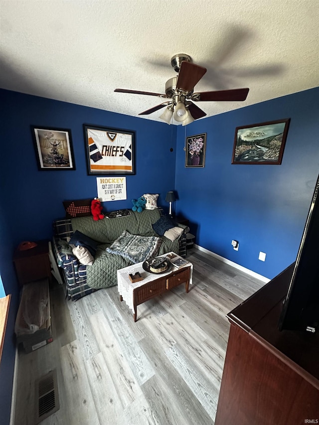 619 Briarfield Dr, Fort Wayne, IN 46825 - living room with ceiling fan, wood finished floors, and a textured ceiling