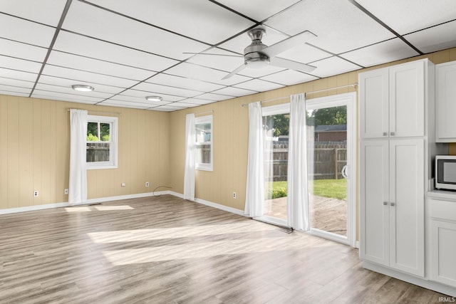 51278 Arch St, Granger, IN 46530 - unfurnished room featuring light wood finished floors, ceiling fan, and a paneled ceiling