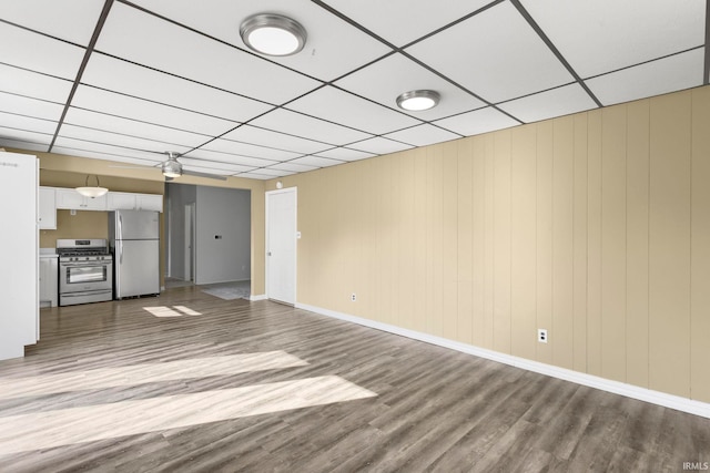 51278 Arch St, Granger, IN 46530 - unfurnished living room featuring wood finished floors and a paneled ceiling