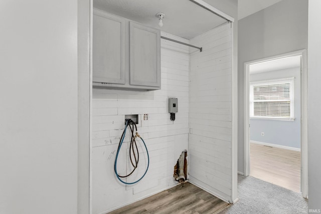 51278 Arch St, Granger, IN 46530 - laundry area featuring cabinet space, washer hookup, and light wood-type flooring