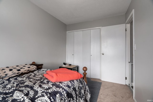 171 Vicksburg Ln, West Lafayette, IN 47906 - bedroom featuring carpet floors, a closet, and a textured ceiling