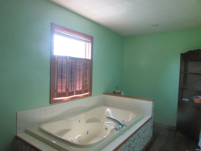 4109 E Woodland Ct, Leesburg, IN 46538 - bathroom with a jetted tub and wood finished floors