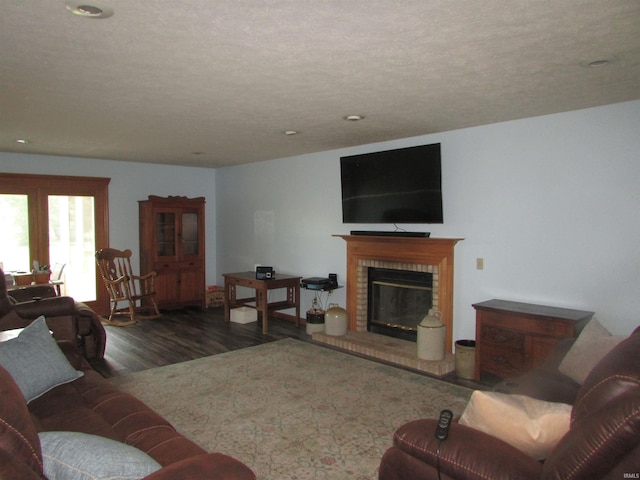 4109 E Woodland Ct, Leesburg, IN 46538 - living area featuring wood finished floors, a brick fireplace, and recessed lighting