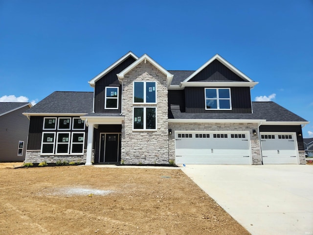 3508 Amesbury Ct, West Lafayette, IN 47906 - craftsman-style home featuring stone siding, board and batten siding, concrete driveway, and an attached garage