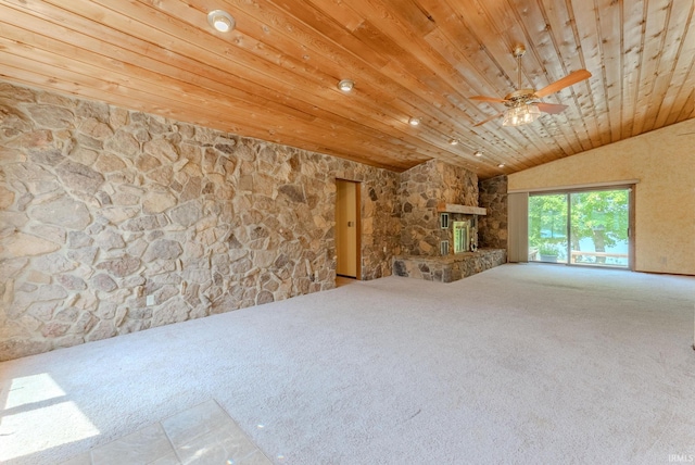 425 E Val Ln, Marion, IN 46952 - unfurnished living room with carpet flooring, wood ceiling, a ceiling fan, vaulted ceiling, and a stone fireplace