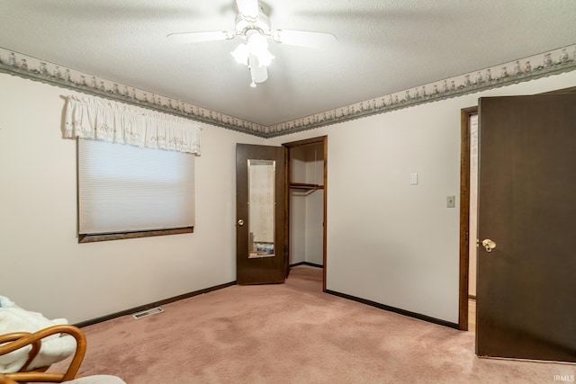 9246 Fritz Rd, Fort Wayne, IN 46818 - unfurnished bedroom with light carpet, ceiling fan, and a closet