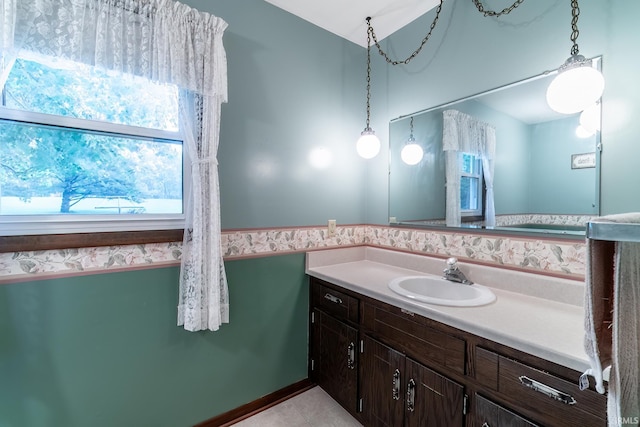 9246 Fritz Rd, Fort Wayne, IN 46818 - bathroom with vanity, a wainscoted wall, and tile patterned floors