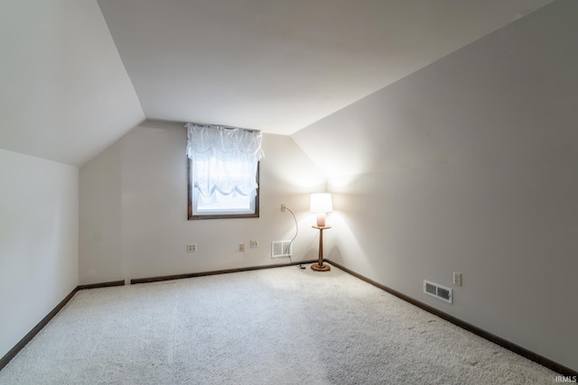 9246 Fritz Rd, Fort Wayne, IN 46818 - additional living space featuring carpet floors and vaulted ceiling