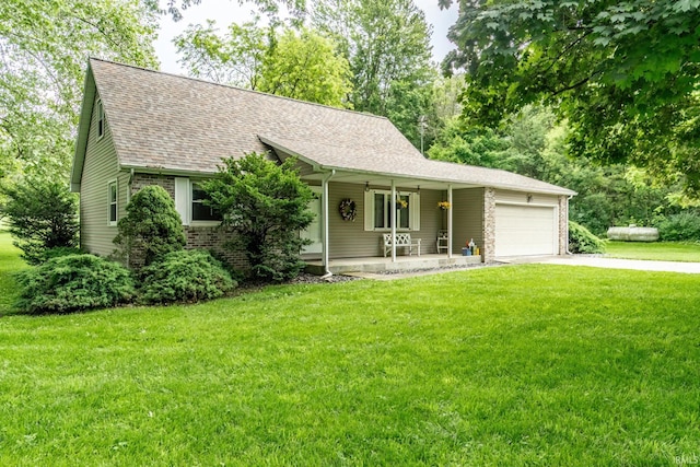 9246 Fritz Rd, Fort Wayne, IN 46818 - view of front of home with covered porch, an attached garage, a front lawn, driveway, and a shingled roof