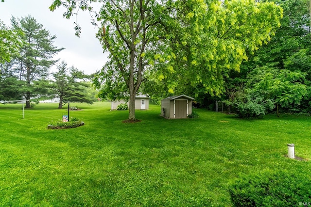 9246 Fritz Rd, Fort Wayne, IN 46818 - view of green lawn featuring a shed