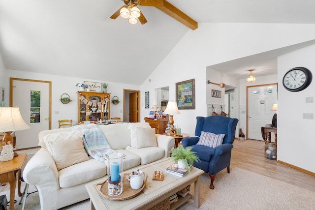 3139 E Colony Ave, Columbia City, IN 46725 - living area with beamed ceiling, a ceiling fan, high vaulted ceiling, and light wood-style floors