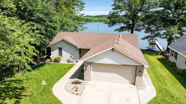 3139 E Colony Ave, Columbia City, IN 46725 - view of front facade with brick siding, concrete driveway, a shingled roof, an attached garage, and a front lawn