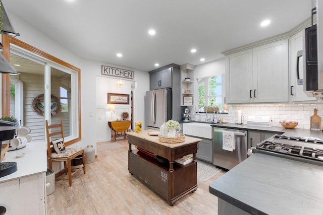 3139 E Colony Ave, Columbia City, IN 46725 - kitchen featuring stainless steel appliances, open shelves, backsplash, light wood finished floors, and recessed lighting