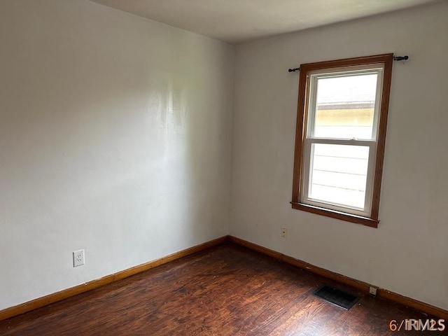 519 E Water St, Mount Vernon, IN 47620 - empty room with dark wood-type flooring and baseboards