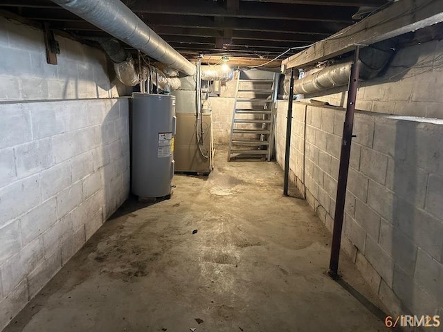 519 E Water St, Mount Vernon, IN 47620 - unfinished below grade area featuring electric water heater and heating unit