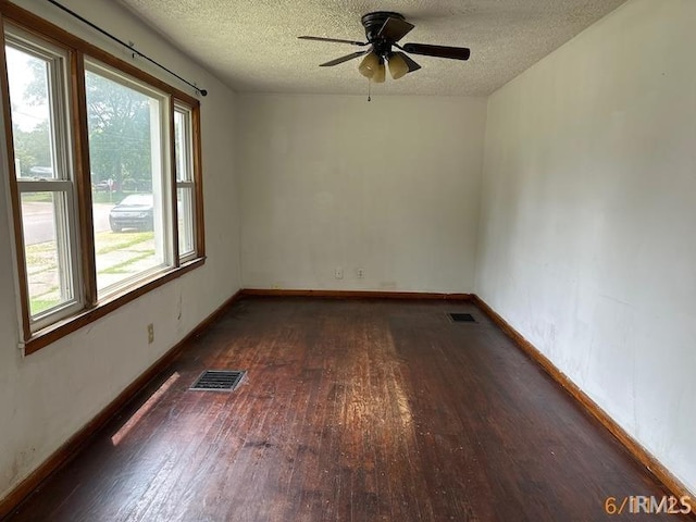 519 E Water St, Mount Vernon, IN 47620 - spare room featuring wood finished floors, a textured ceiling, and a ceiling fan