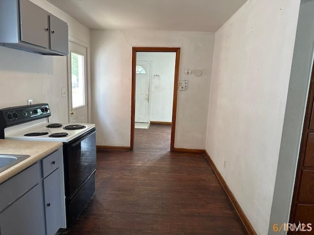 519 E Water St, Mount Vernon, IN 47620 - kitchen featuring electric range oven, dark wood-style flooring, light countertops, and gray cabinets