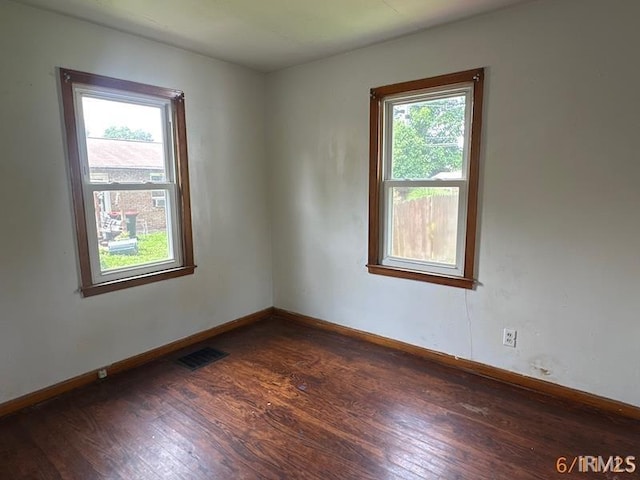 519 E Water St, Mount Vernon, IN 47620 - unfurnished room with dark wood-type flooring and baseboards