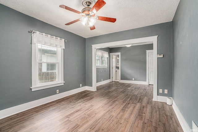 240 Bank St, Elkhart, IN 46516 - spare room with ceiling fan, wood finished floors, and a textured ceiling