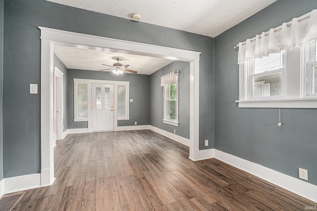240 Bank St, Elkhart, IN 46516 - entryway with wood finished floors, a ceiling fan, and a textured ceiling