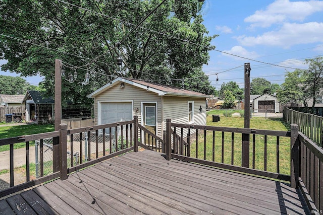 240 Bank St, Elkhart, IN 46516 - wooden terrace with an outdoor structure, a detached garage, and a fenced backyard
