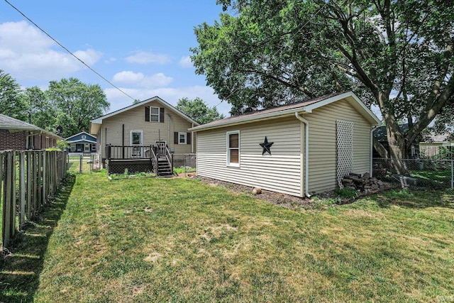 240 Bank St, Elkhart, IN 46516 - back of property with a wooden deck and a fenced backyard