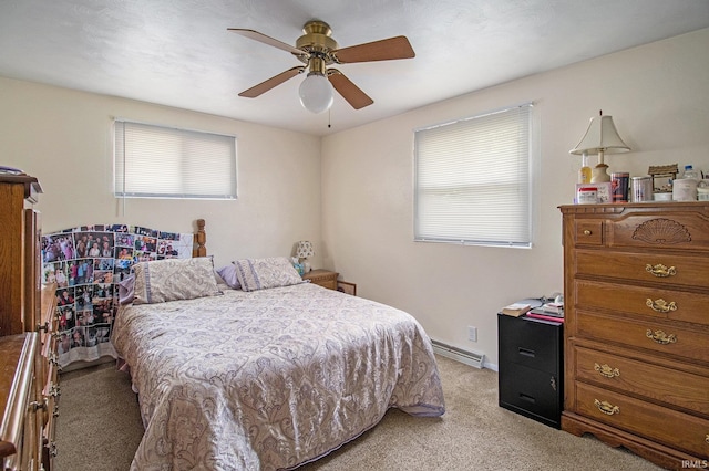 3301 Cabot Dr, South Bend, IN 46635 - bedroom featuring light carpet, multiple windows, a baseboard radiator, and a ceiling fan