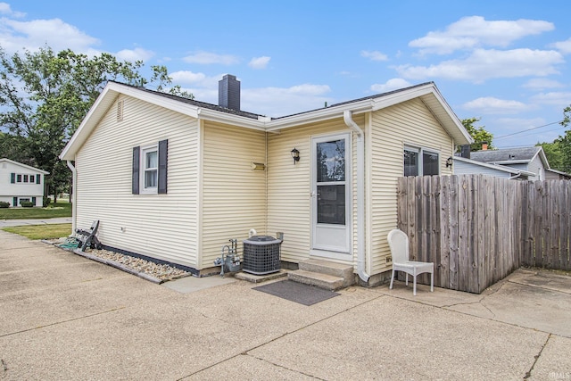3301 Cabot Dr, South Bend, IN 46635 - back of house featuring a chimney, entry steps, and a patio area