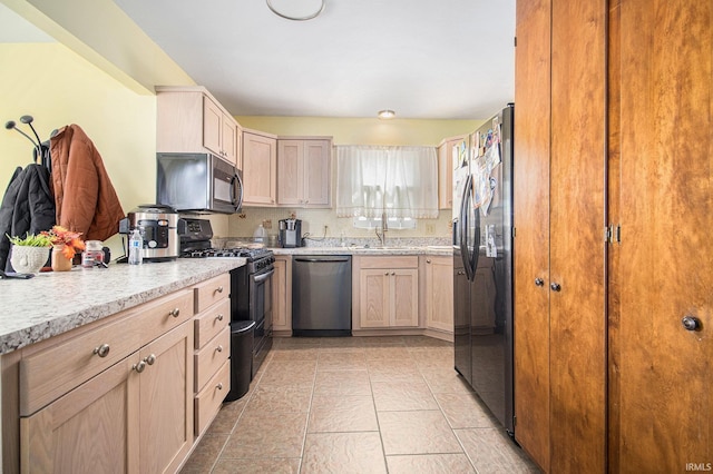 3301 Cabot Dr, South Bend, IN 46635 - kitchen with stainless steel appliances and light brown cabinets