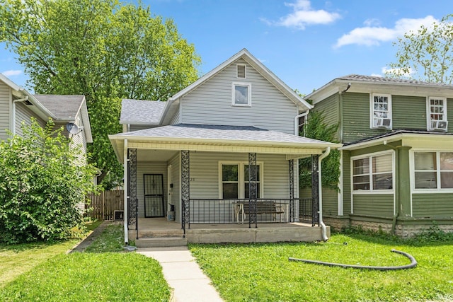 2725 Fox Ave, Fort Wayne, IN 46807 - view of front of property featuring covered porch, a front yard, and roof with shingles