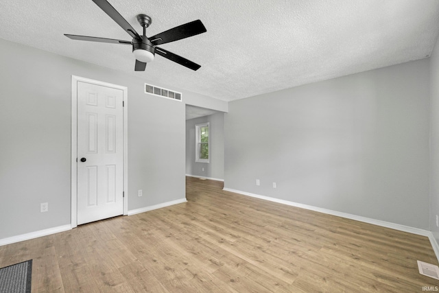 2725 Fox Ave, Fort Wayne, IN 46807 - spare room with ceiling fan, light wood-style floors, and a textured ceiling