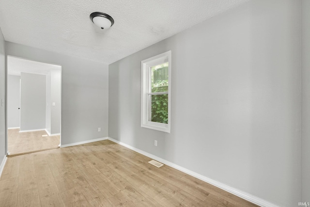 2725 Fox Ave, Fort Wayne, IN 46807 - unfurnished room featuring light wood finished floors and a textured ceiling