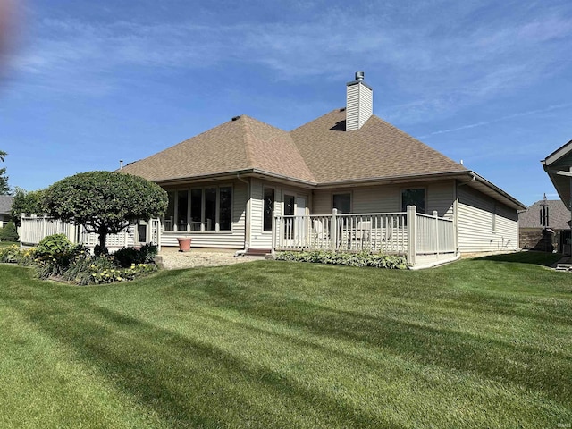6420 Langley Ct, Fort Wayne, IN 46815 - rear view of property with a chimney, roof with shingles, a yard, and a wooden deck