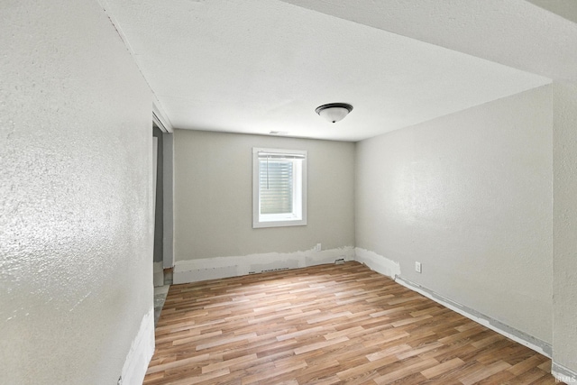 919 S 18th St, Lafayette, IN 47905 - empty room featuring light wood-style flooring and a textured wall