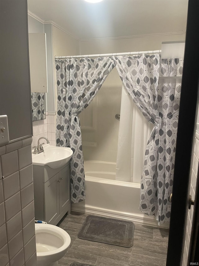 517 S Main St, Jonesboro, IN 46938 - full bathroom with tile walls, shower / bath combo, vanity, ornamental molding, and wood finished floors