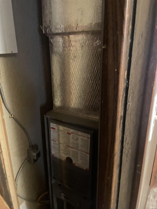517 S Main St, Jonesboro, IN 46938 - utility room featuring heating unit