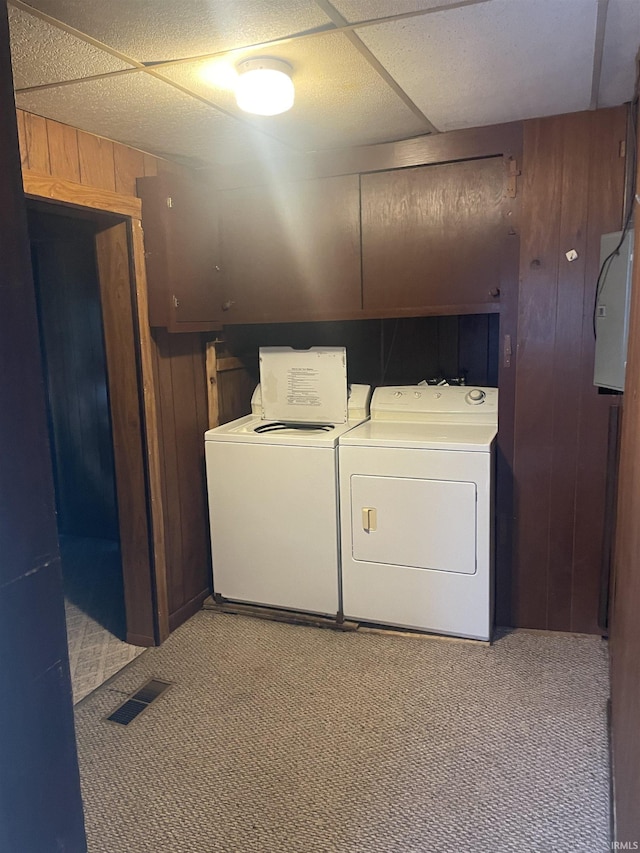 517 S Main St, Jonesboro, IN 46938 - laundry area with independent washer and dryer, light carpet, wood walls, and electric panel