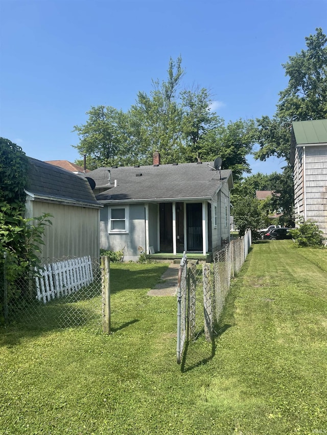 517 S Main St, Jonesboro, IN 46938 - rear view of house with a chimney
