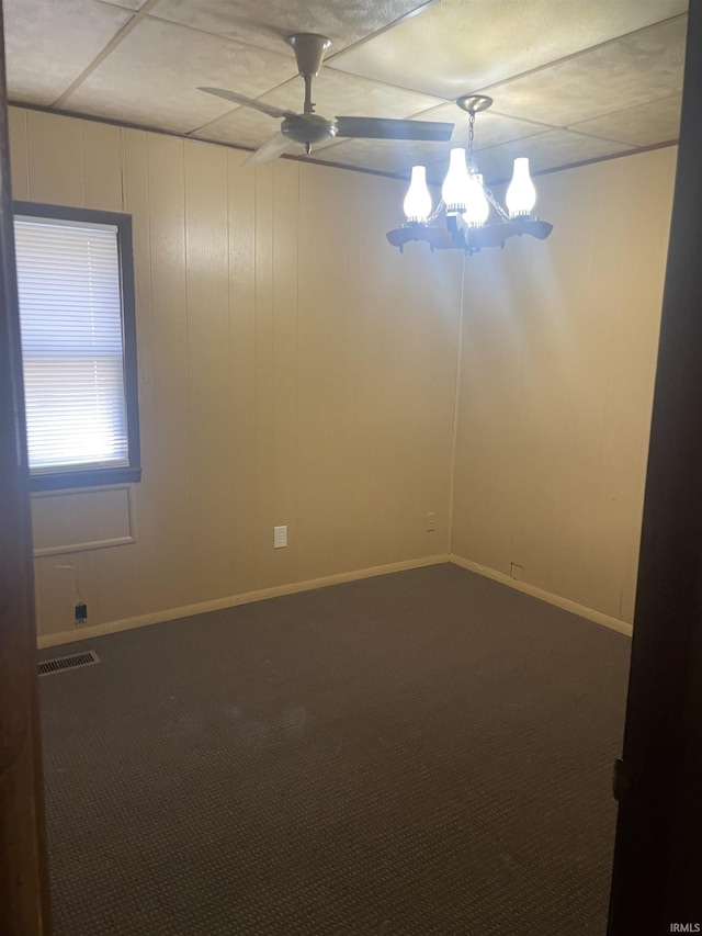 517 S Main St, Jonesboro, IN 46938 - carpeted empty room with a chandelier and a ceiling fan