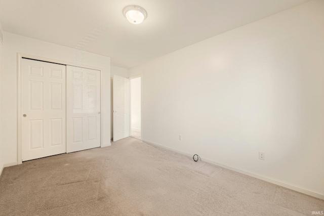 1408 Duesenberg Dr, Auburn, IN 46706 - unfurnished bedroom with light carpet and a closet