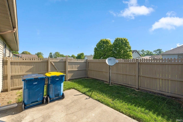 1408 Duesenberg Dr, Auburn, IN 46706 - fenced backyard with a patio area