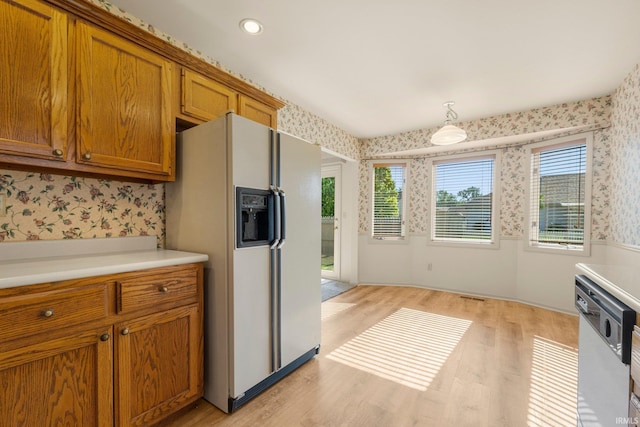 1408 Duesenberg Dr, Auburn, IN 46706 - kitchen featuring white appliances, wallpapered walls, brown cabinetry, light countertops, and light wood-style floors