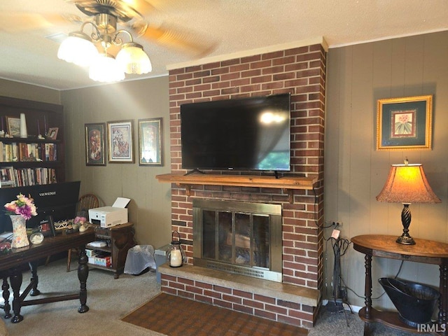 1723 W Timberview Dr, Marion, IN 46952 - carpeted living room with a ceiling fan, a fireplace, and crown molding