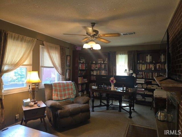 1723 W Timberview Dr, Marion, IN 46952 - office space featuring healthy amount of natural light, ceiling fan, a textured ceiling, and carpet flooring
