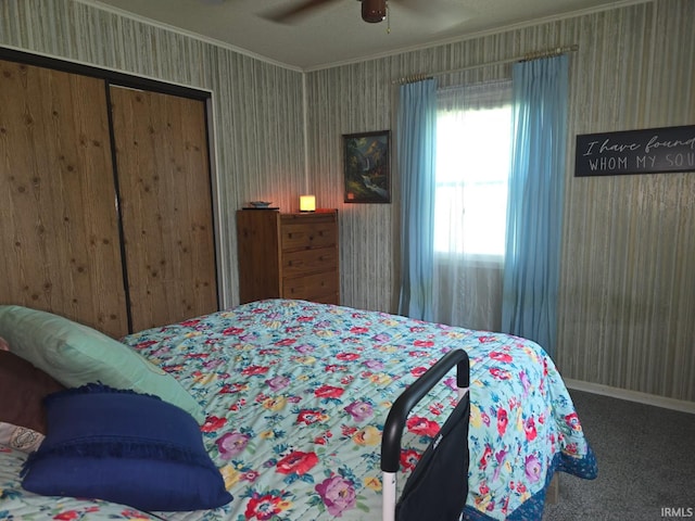 1723 W Timberview Dr, Marion, IN 46952 - bedroom featuring crown molding, wallpapered walls, carpet flooring, a ceiling fan, and a closet