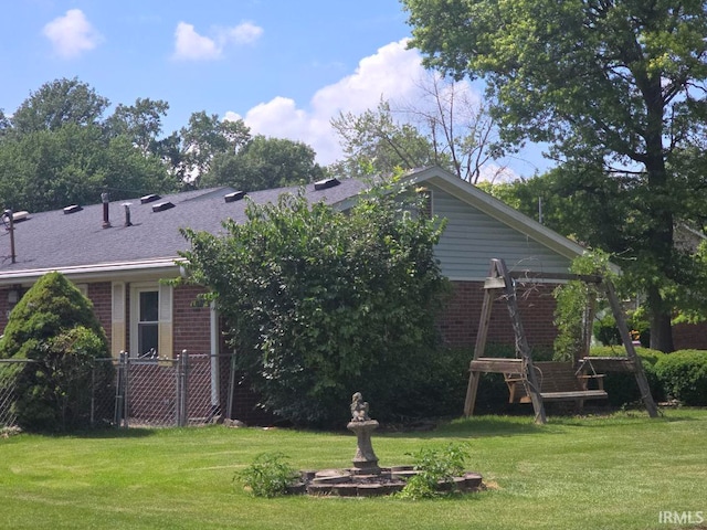 1723 W Timberview Dr, Marion, IN 46952 - back of property with brick siding and a yard