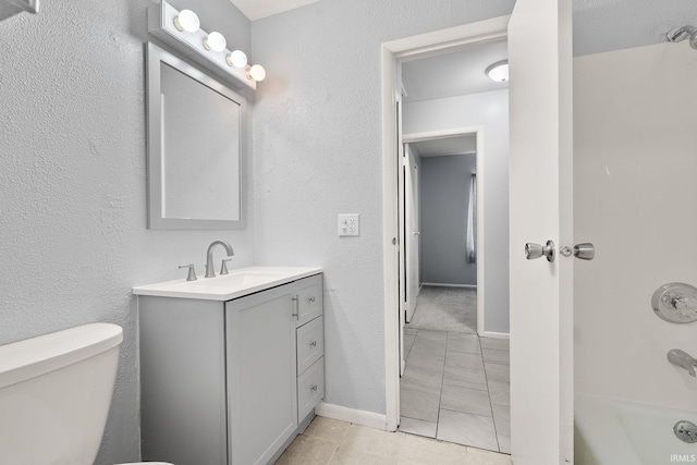 415 Grapevine Ln, Fort Wayne, IN 46825 - full bathroom with vanity, tile patterned floors, and washtub / shower combination